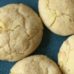 lemon vanilla crinkle cookies on a square blue plate