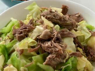 Instant Pot Kalua Pork with cabbage in a large serving bowl.