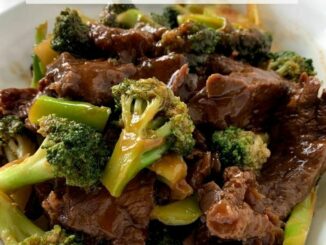 Broccoli Beef is ready to eat, photographed in a white serving bowl.