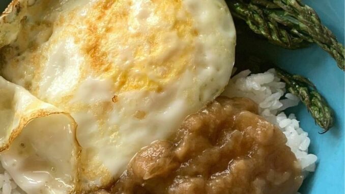 Dairy-Free-Make-Ahead-Beef-Gravy-Recipe-1-2 Dairy-free beef gravy over rice, served with an over easy egg and roasted asparagus in a blue bowl
