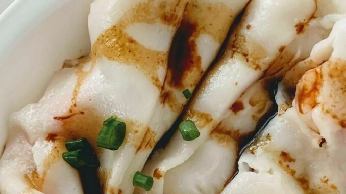 shrimp-rice-rolls-nom-wah shrimp rice roll drizzled with a sweet soy sauce in a white plate